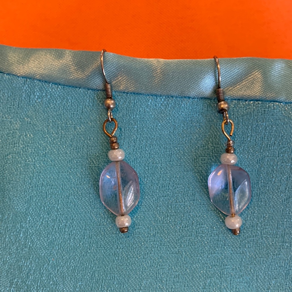 Clear glass stone earrings with a lavender hue.